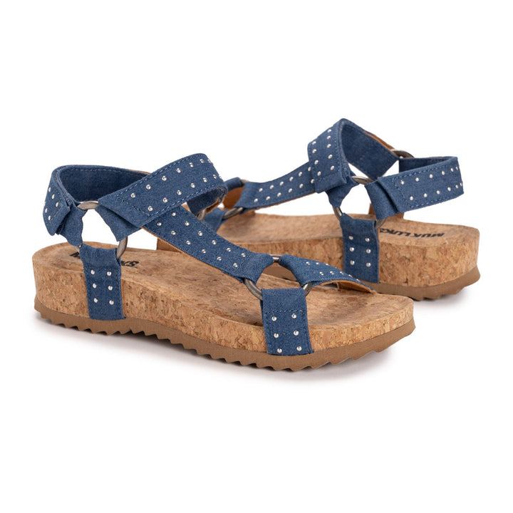 Pair of blue sandals with cork soles on a white background