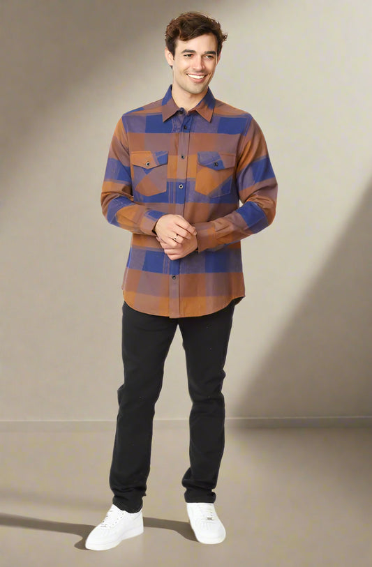 Man wearing a plaid shirt with brown and blue pattern on a white background