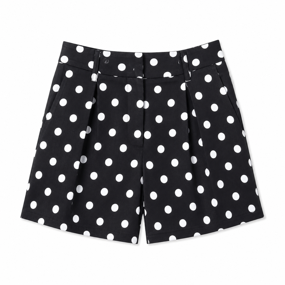 Black shorts with white polka dots on a white background