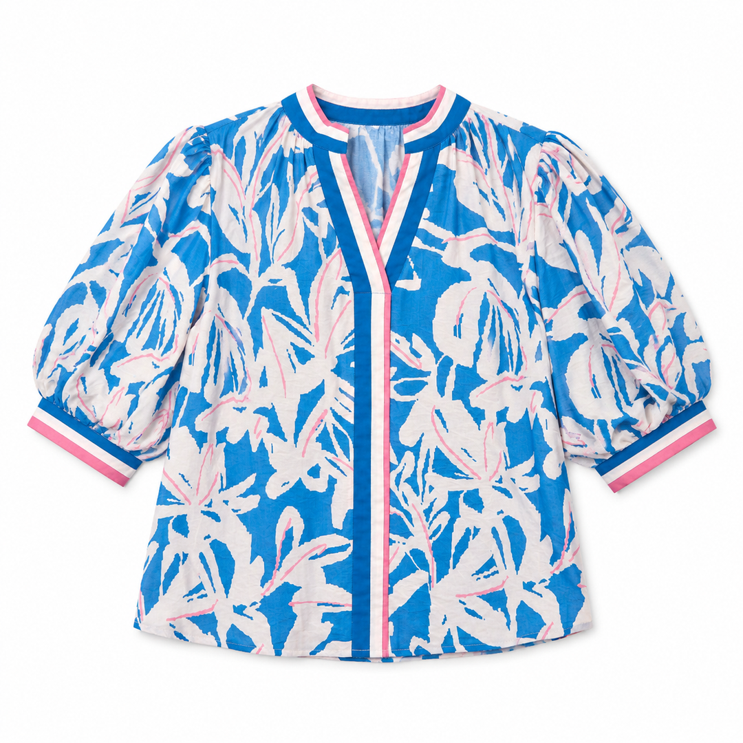 Blue and white floral patterned jacket on a white background