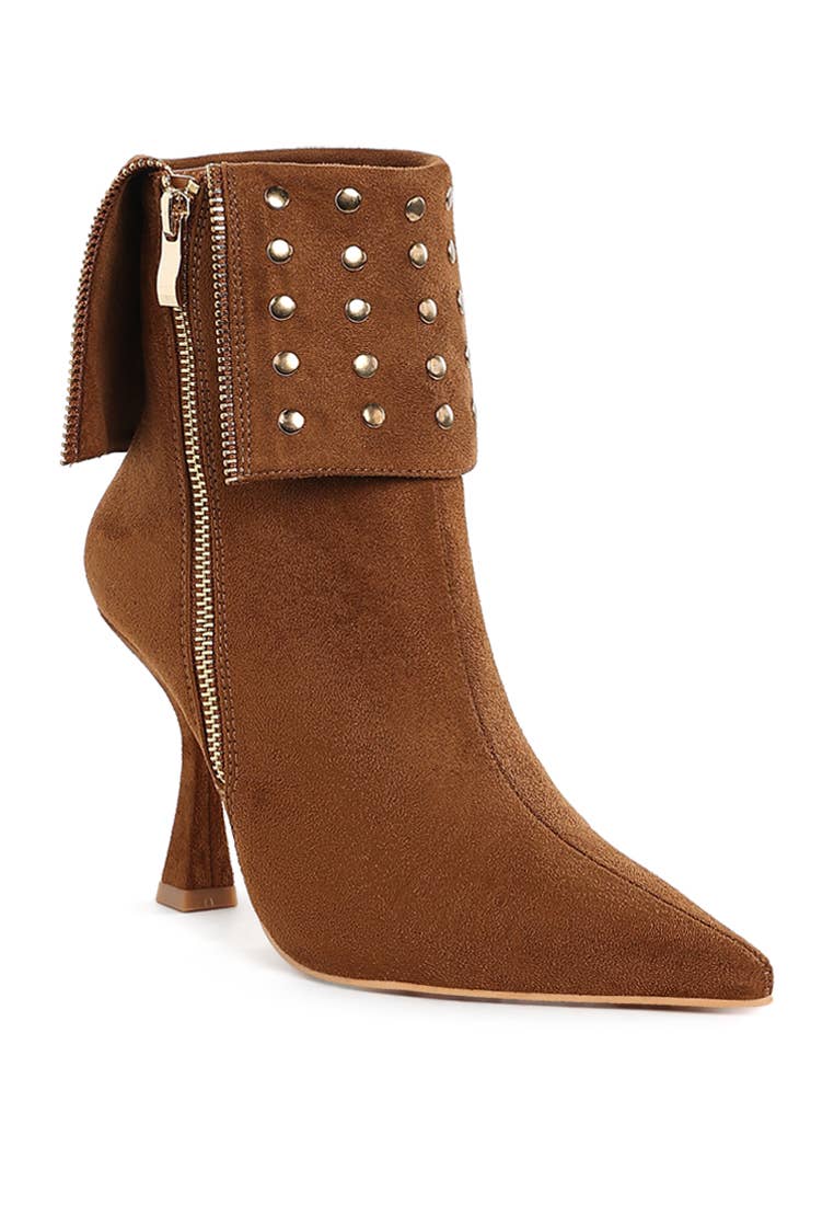 Brown ankle boot with studded details on a white background