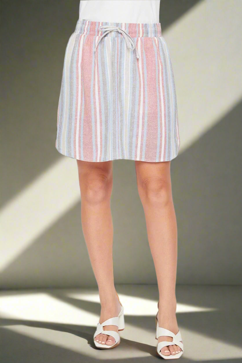 Striped shorts worn by a person on a white background