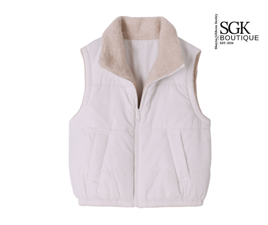 White puffer vest with beige interior on a white background, featuring SGK Boutique logo.