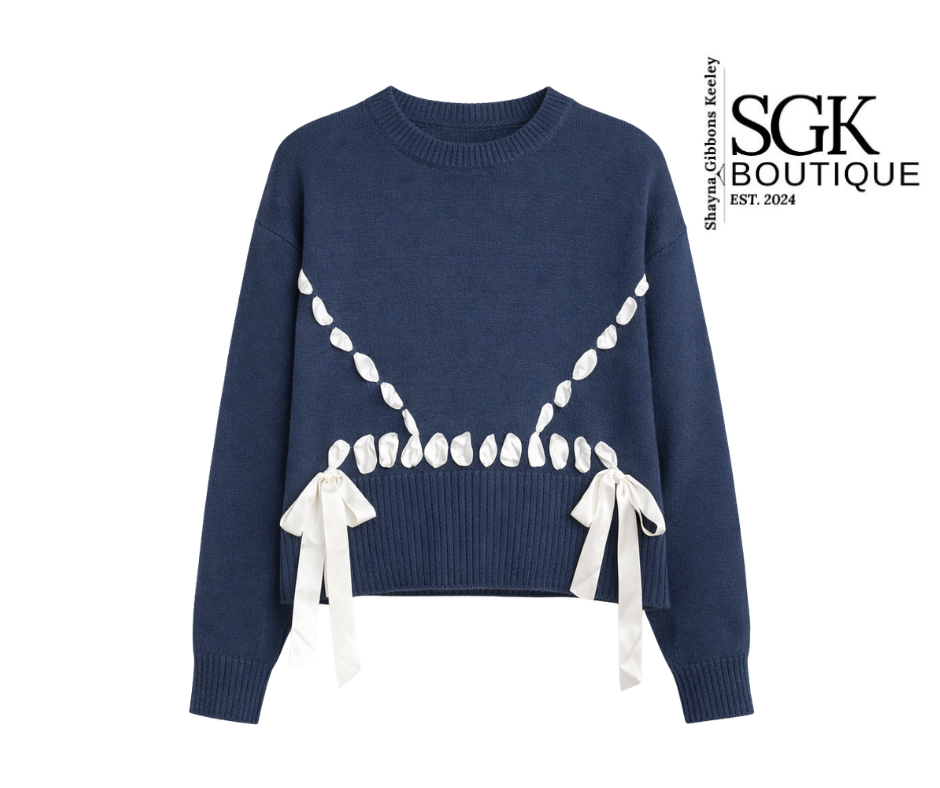 Navy blue sweater with white bow details on a white background, featuring SGK Boutique logo.
