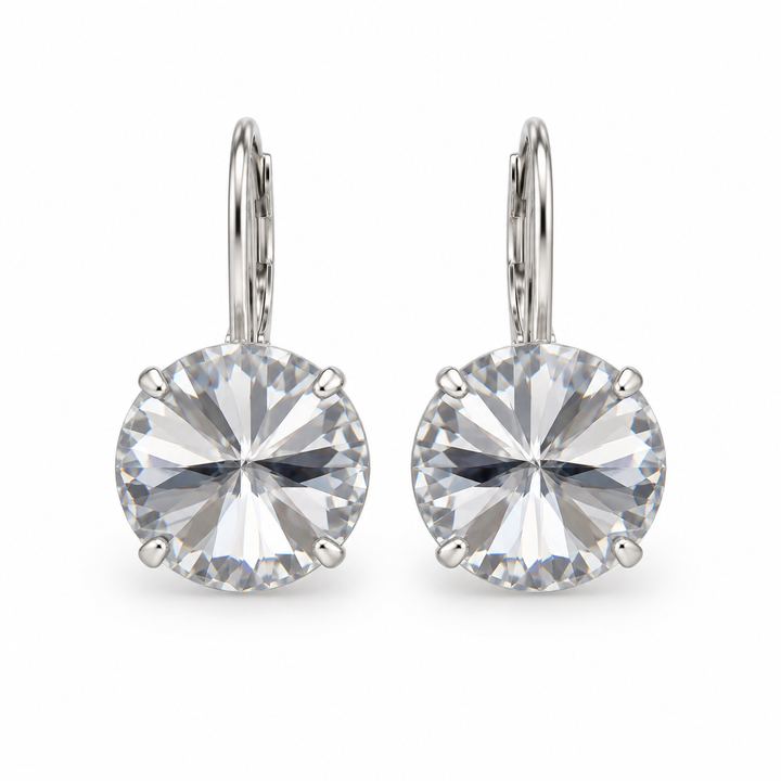 A pair of silver leverback earrings with large, round-cut clear gemstones in a four-prong setting, shown against a plain white background.