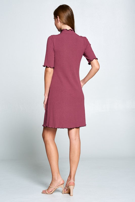 Woman wearing a pink dress on a white background