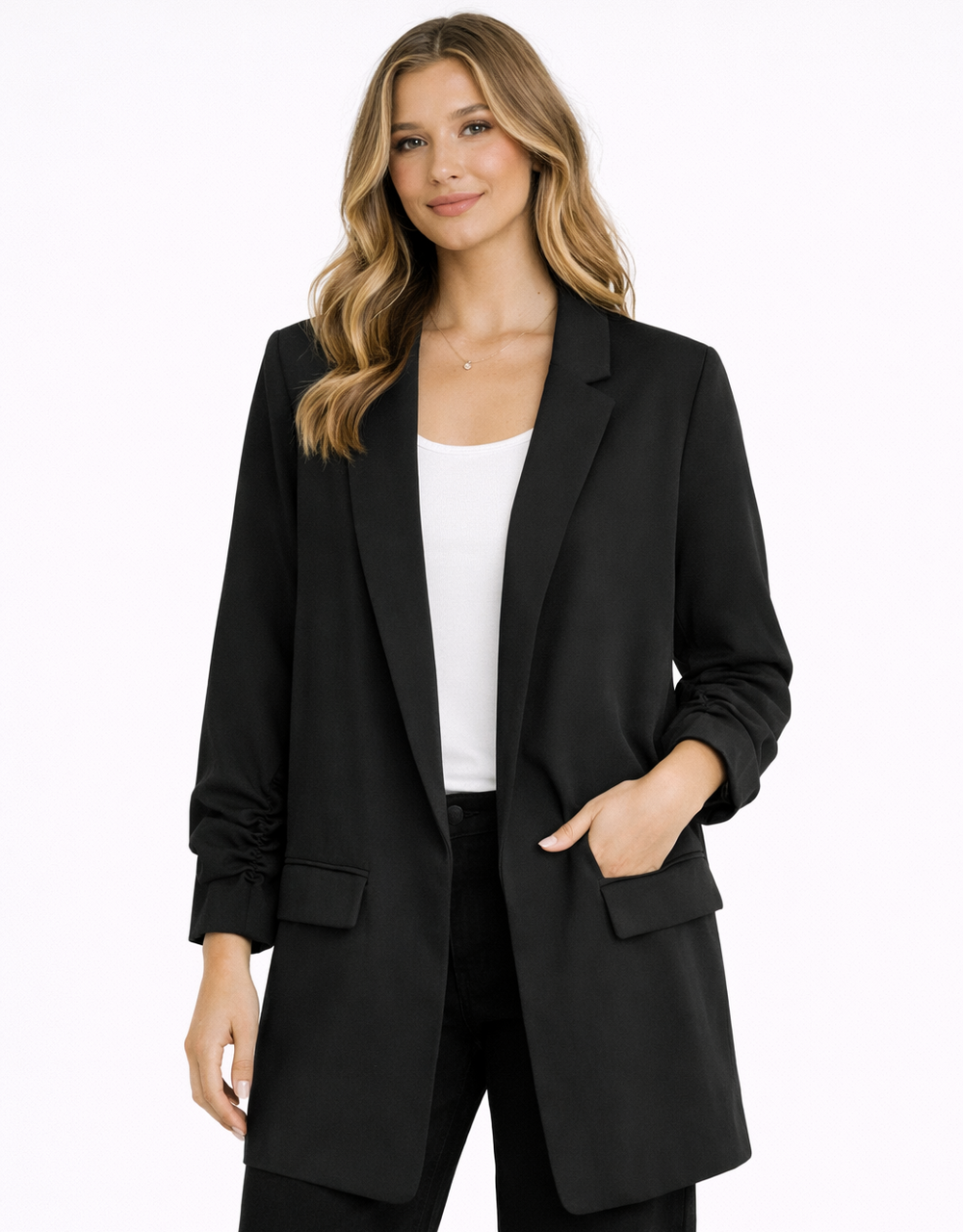 Woman wearing a black suit with a white top on a white background