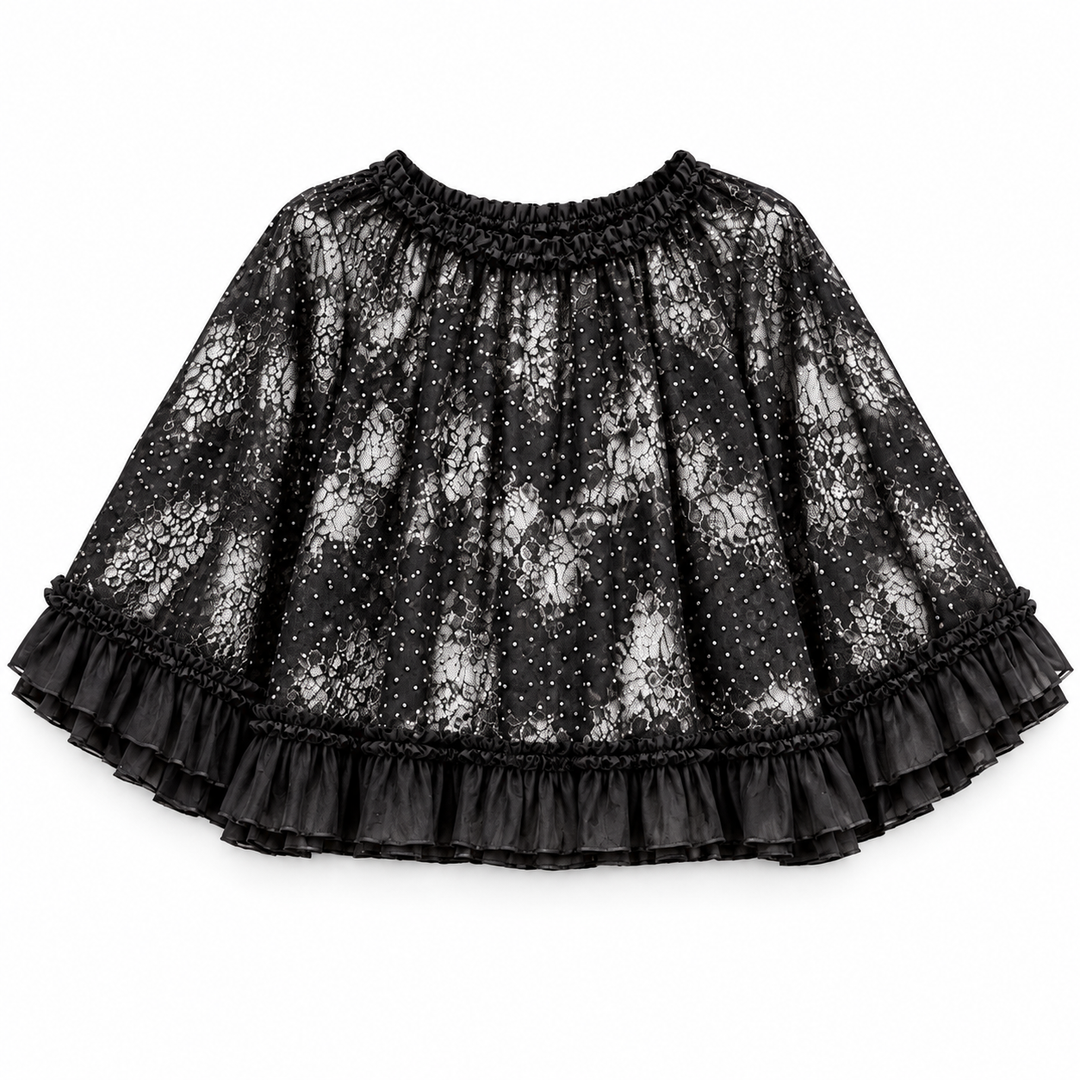 A black lace and mesh mini skirt with a smocked waistband, dotted pattern, and tiered ruffle hem, shown flat on a white background.