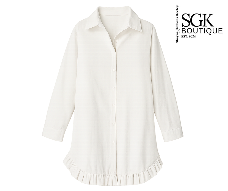 White blouse with ruffled hem on a white background, featuring SGK Boutique branding.