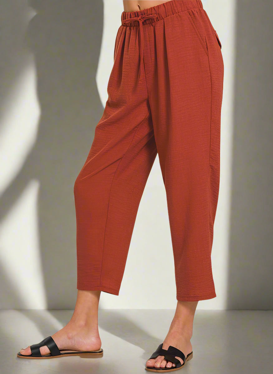Rust-colored pants on a white background