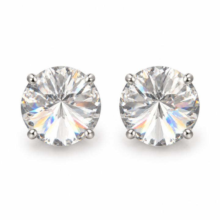 A pair of round-cut stud earrings in a silver-toned four-prong setting, featuring brilliant clear gemstones with rainbow reflections, shown on a plain white background.