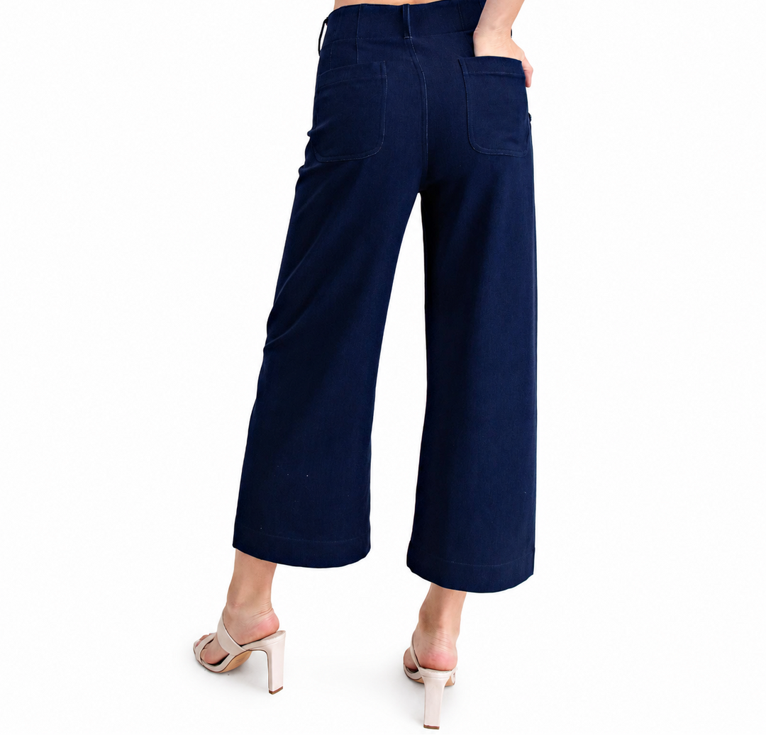 Navy blue wide-leg pants worn by a person on a white background
