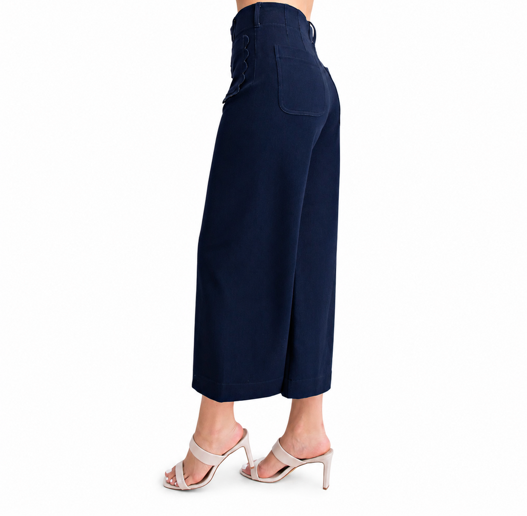 Navy blue wide-leg pants worn by a person on a white background