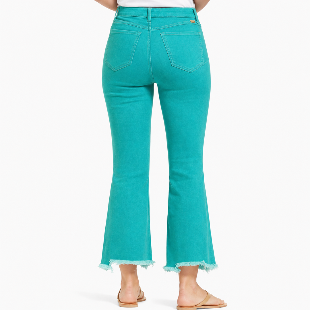 Teal jeans with a white background