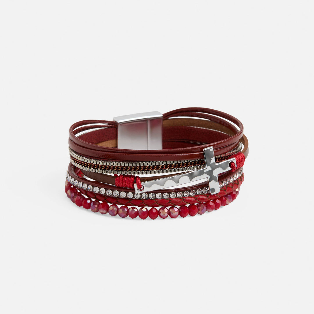 Multistrand bracelet with brown leather, red beads, and silver accents on a white background
