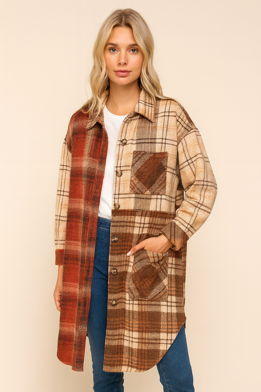 Woman wearing a plaid coat with a neutral background
