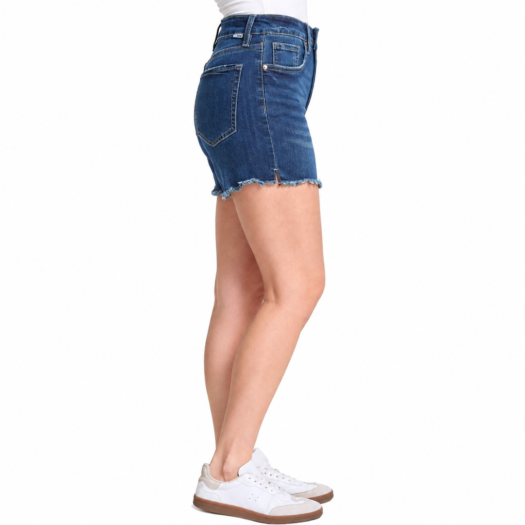 Denim skirt worn by a person on a white background