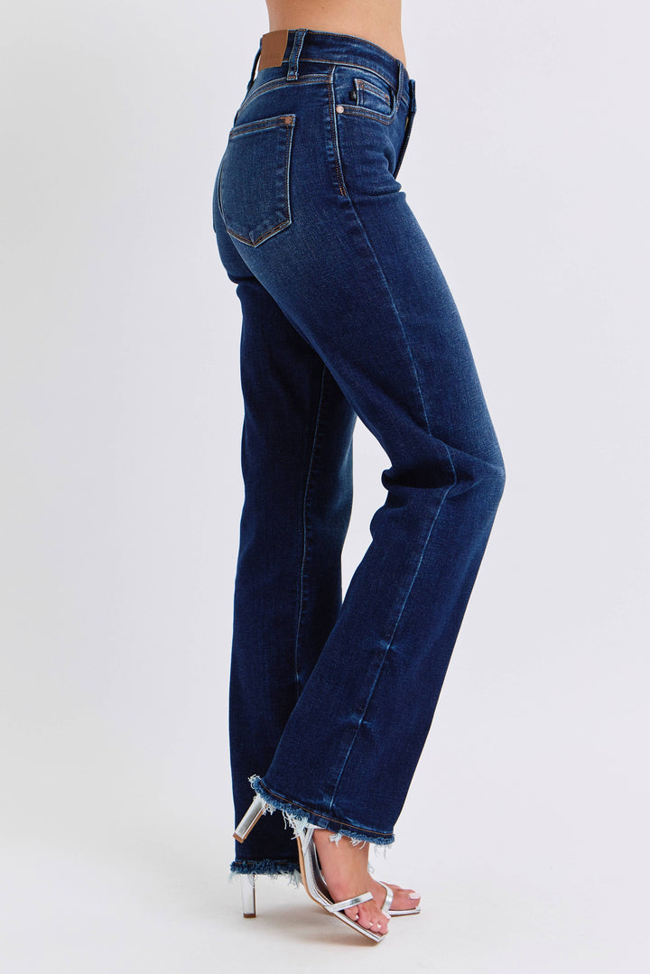 Blue jeans worn by a person on a white background