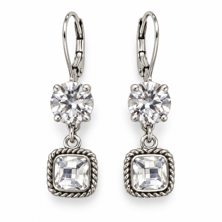 A pair of silver leverback drop earrings featuring a round clear crystal and a square cushion-cut clear crystal, both set in silver-toned metal with a rope-textured border on a white background.