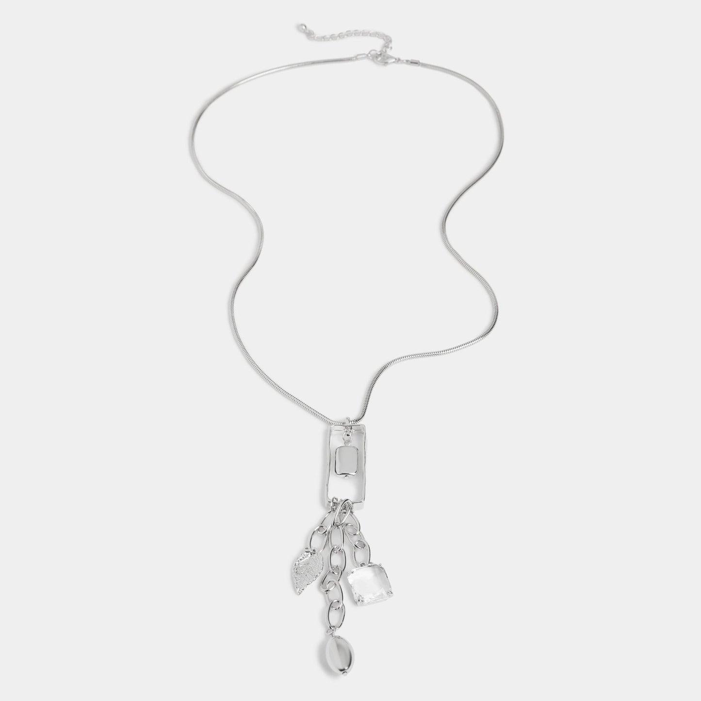 Silver necklace with pendant on a light gray background