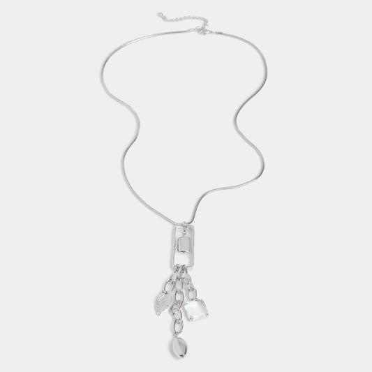 Silver necklace with pendant on a light gray background