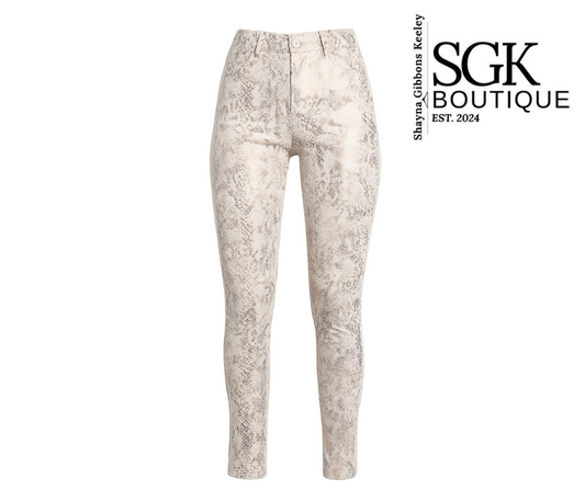 Patterned pants on a white background with SGK Boutique branding.