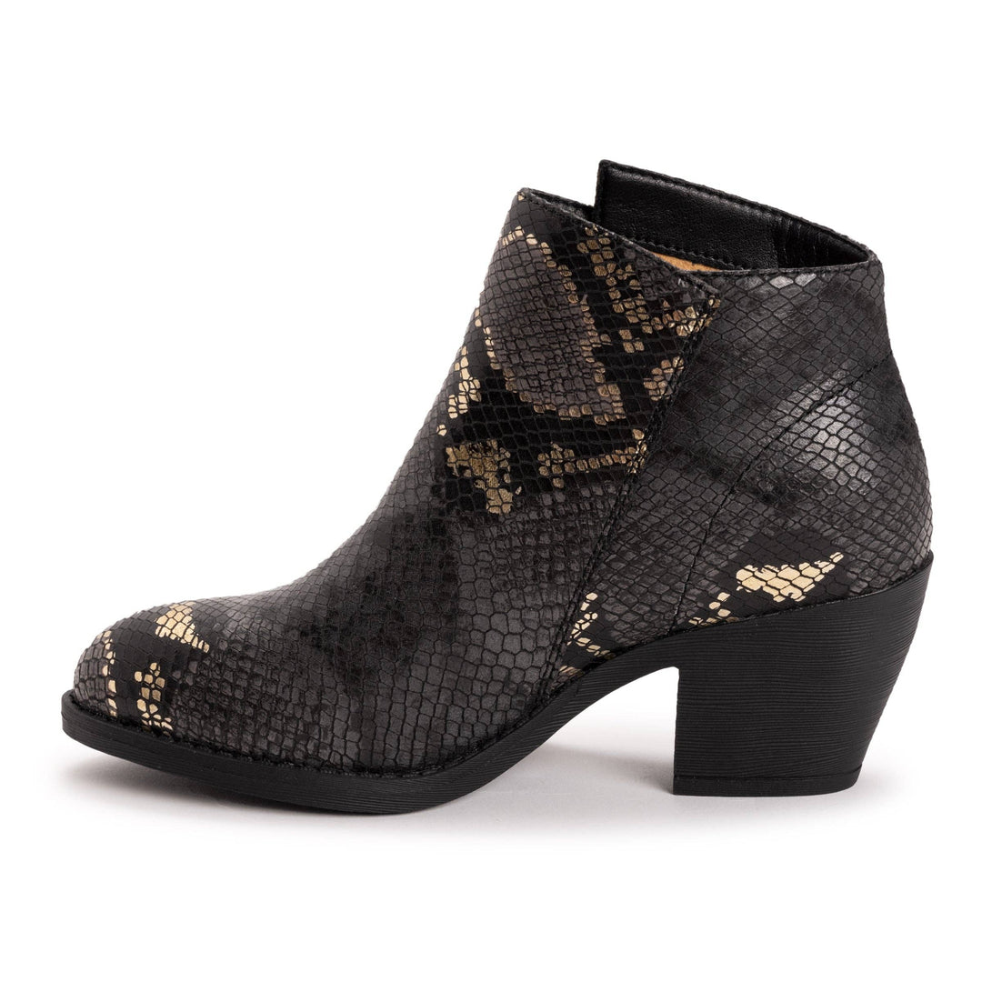 A black ankle boot with a snakeskin pattern featuring metallic gold accents, set against a plain white background.