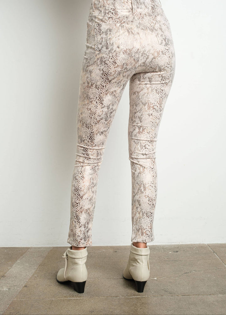 Patterned pants worn by a person on a plain background
