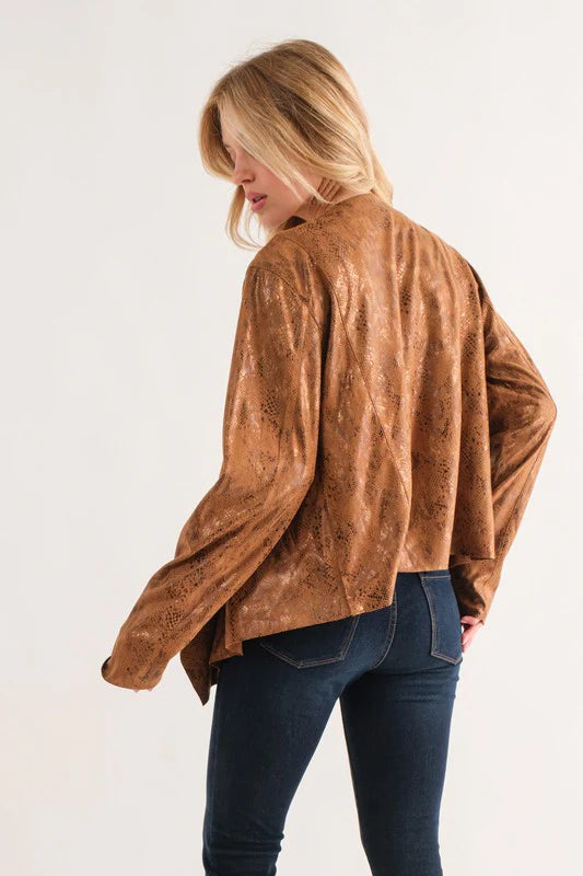 Person wearing a brown suede jacket on a white background