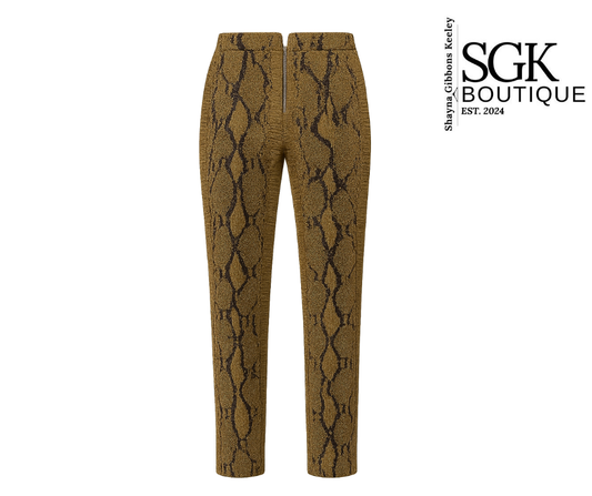 Snakeskin-patterned pants on a white background with SGK Boutique logo.