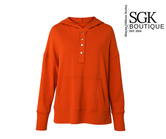 Orange hoodie with button details on a white background, featuring SGK Boutique logo.