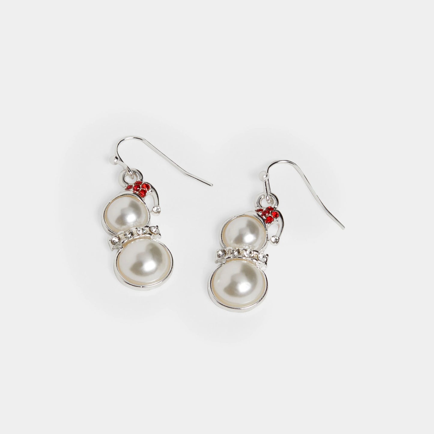 Pair of pearl earrings with red accents on a white background