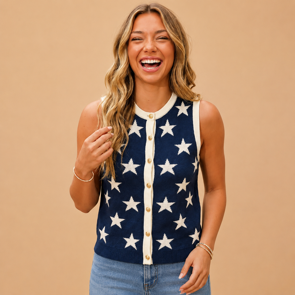 Woman wearing a navy cardigan with white star patterns on a beige background