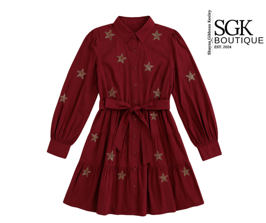 Wine dress with star patterns on a white background, featuring SGK Boutique branding.