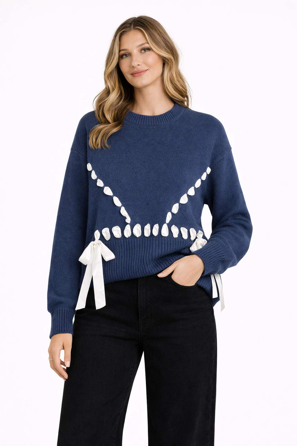 Woman wearing a blue sweater with white accents on a white background