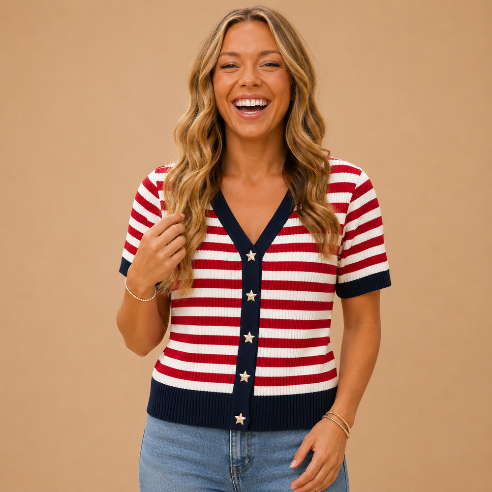 Woman wearing a red, white, and blue striped sweater with star accents on a beige background