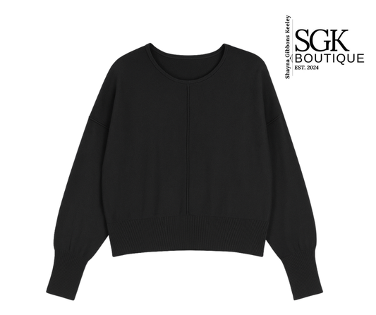 Black sweater on a white background with SGK Boutique logo.