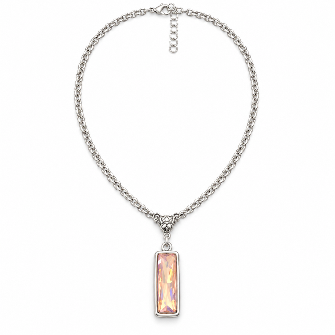 A silver-tone chain necklace with a rectangular iridescent pink pendant, displayed on a clean white background.