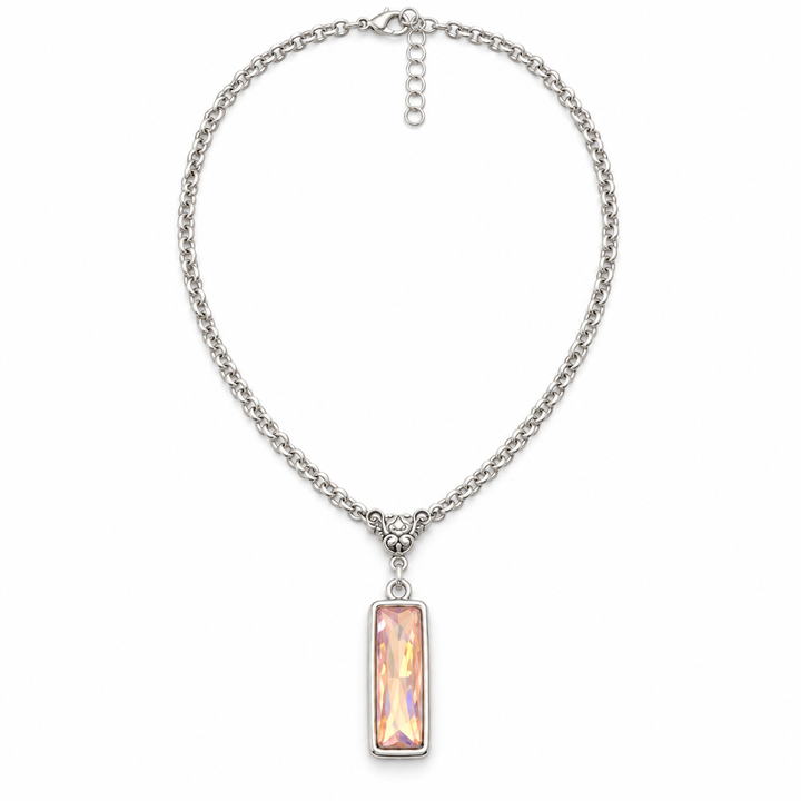 A silver-tone chain necklace with a rectangular iridescent pink pendant, displayed on a clean white background.