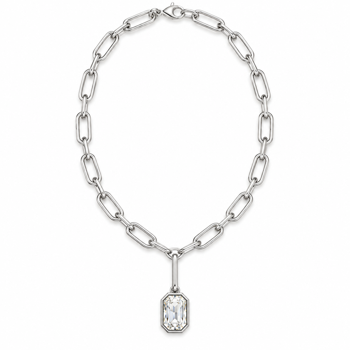 A silver paperclip chain necklace with a rectangular clear crystal pendant, displayed on a clean white background.