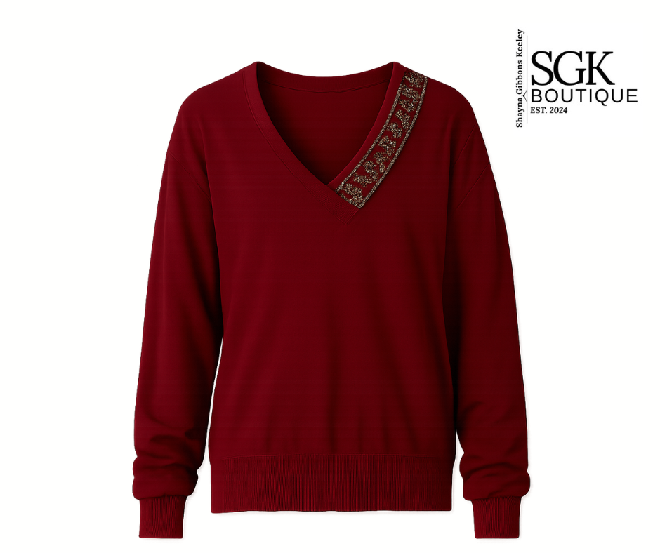 Wine sweater with floral embroidery on a white background, featuring the SGK Boutique logo.