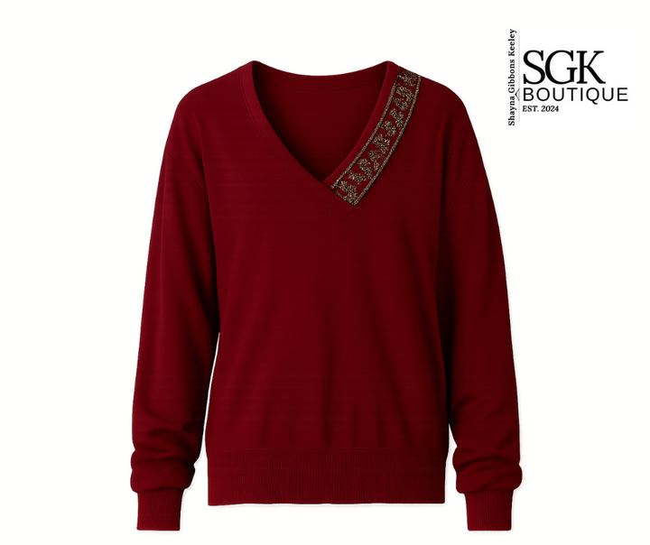 Wine sweater with floral embroidery on a white background, featuring the SGK Boutique logo.