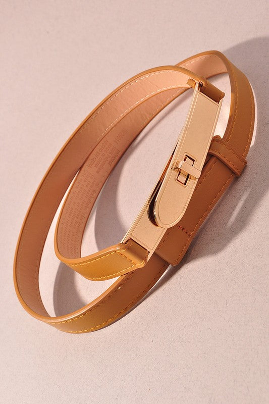 Gold belt on a beige background