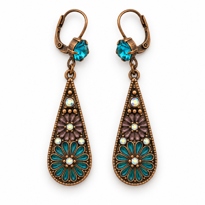 A pair of antique bronze leverback drop earrings with turquoise and purple floral enamel details and white faux pearl accents, shown on a plain white background.