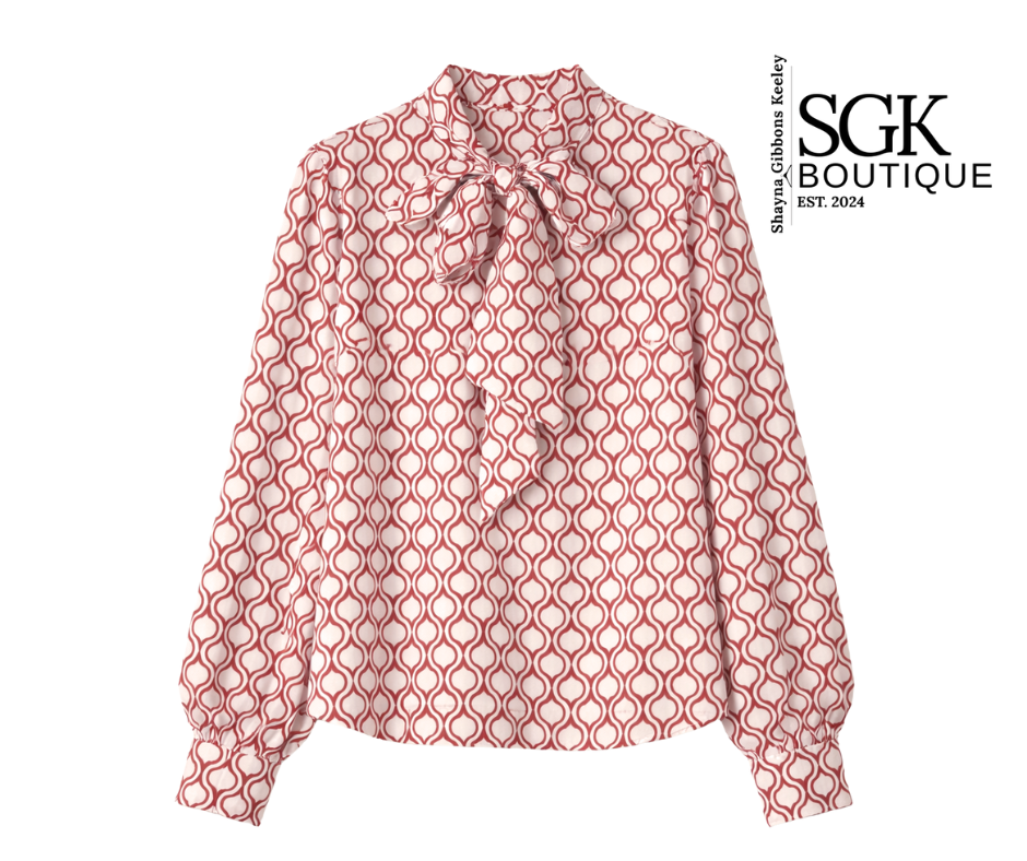 Red patterned blouse on a white background with SGK Boutique logo.