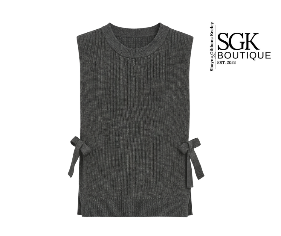 Gray sleeveless knitted dress with bow details on a white background, featuring SGK Boutique branding.