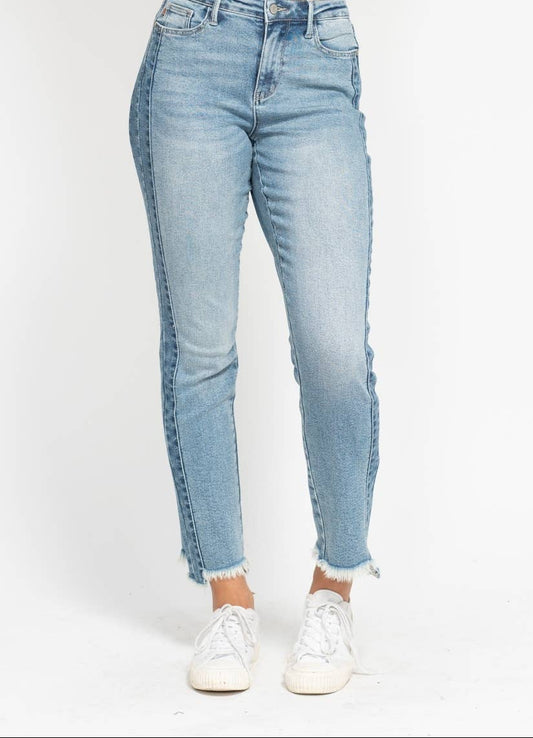 Light blue jeans worn by a person on a white background