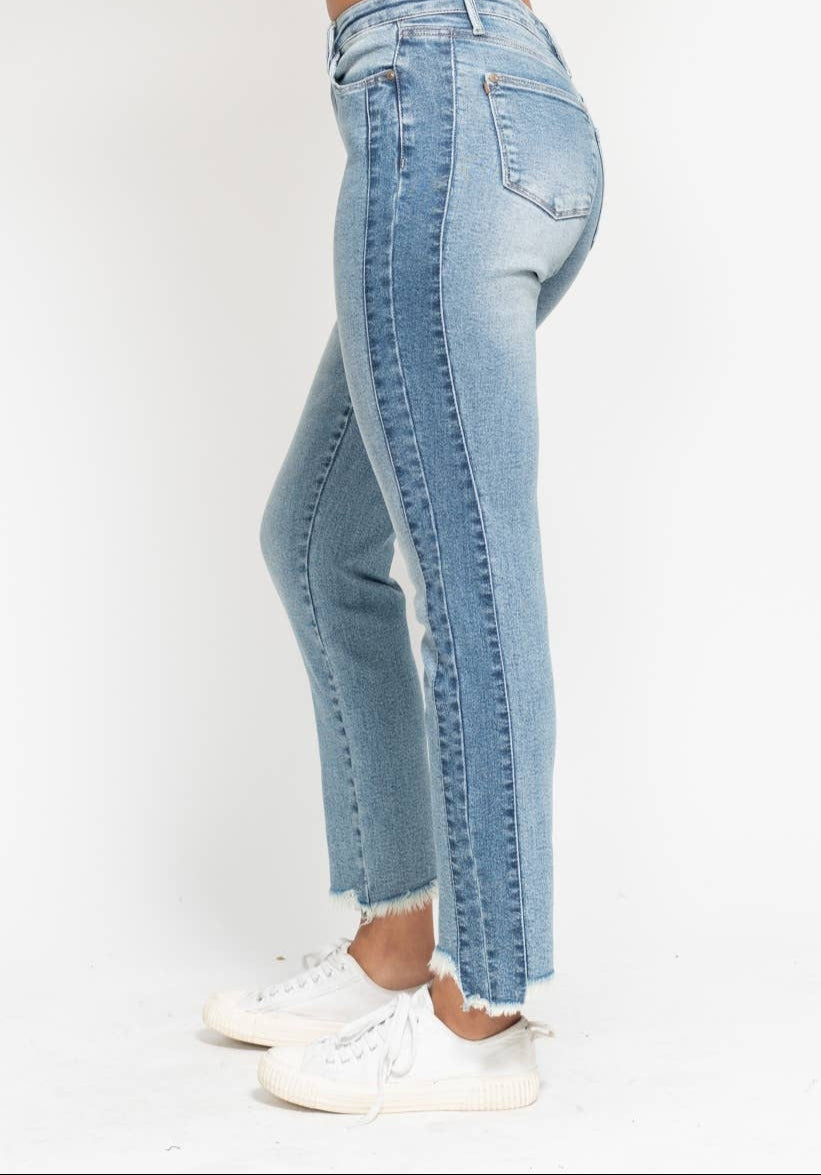 Light blue jeans worn by a person on a white background