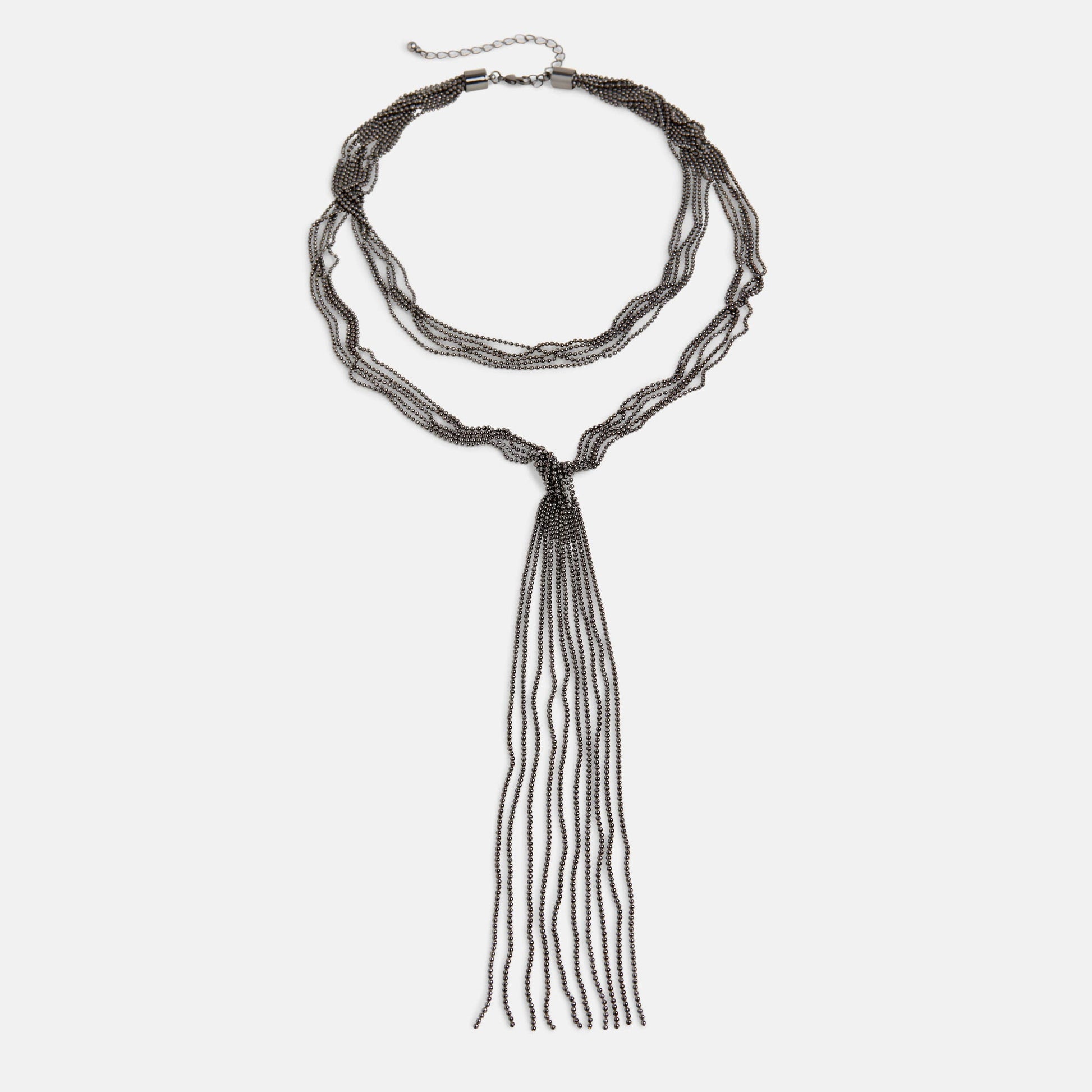 Long beaded necklace with tassel on a white background