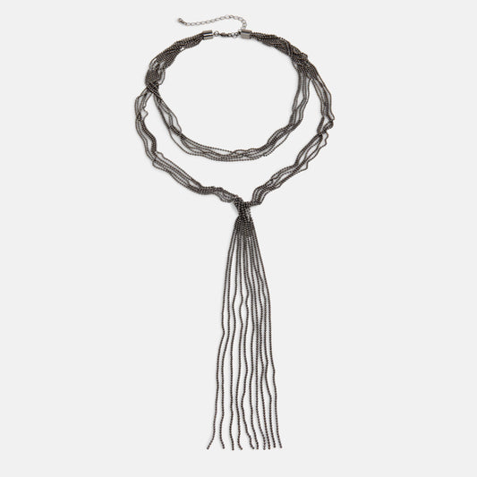 Long beaded necklace with tassel on a white background